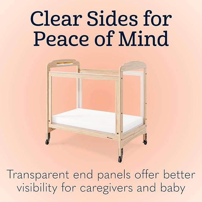 Foundations Serenity Compact Clearview Daycare Crib, Fixed Side, Durable Wood Construction, Non-Marking Casters (2 Locking), Includes 3” InfaPure Foam Mattress (Natural)