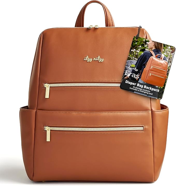 Itzy Ritzy Eras Diaper Bag Backpack – Large Capacity Backpack Diaper Bag Featuring Sleek Design, 15 Pockets, Changing Pad, Stroller Straps, and Luggage Sleeve (Cognac)
